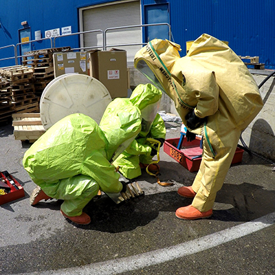 Two people in hazmat suits