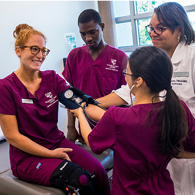 Medical Assisting students taking blood pressure