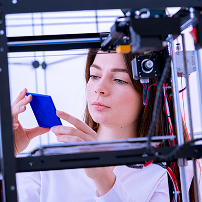 Student using a 3D printer